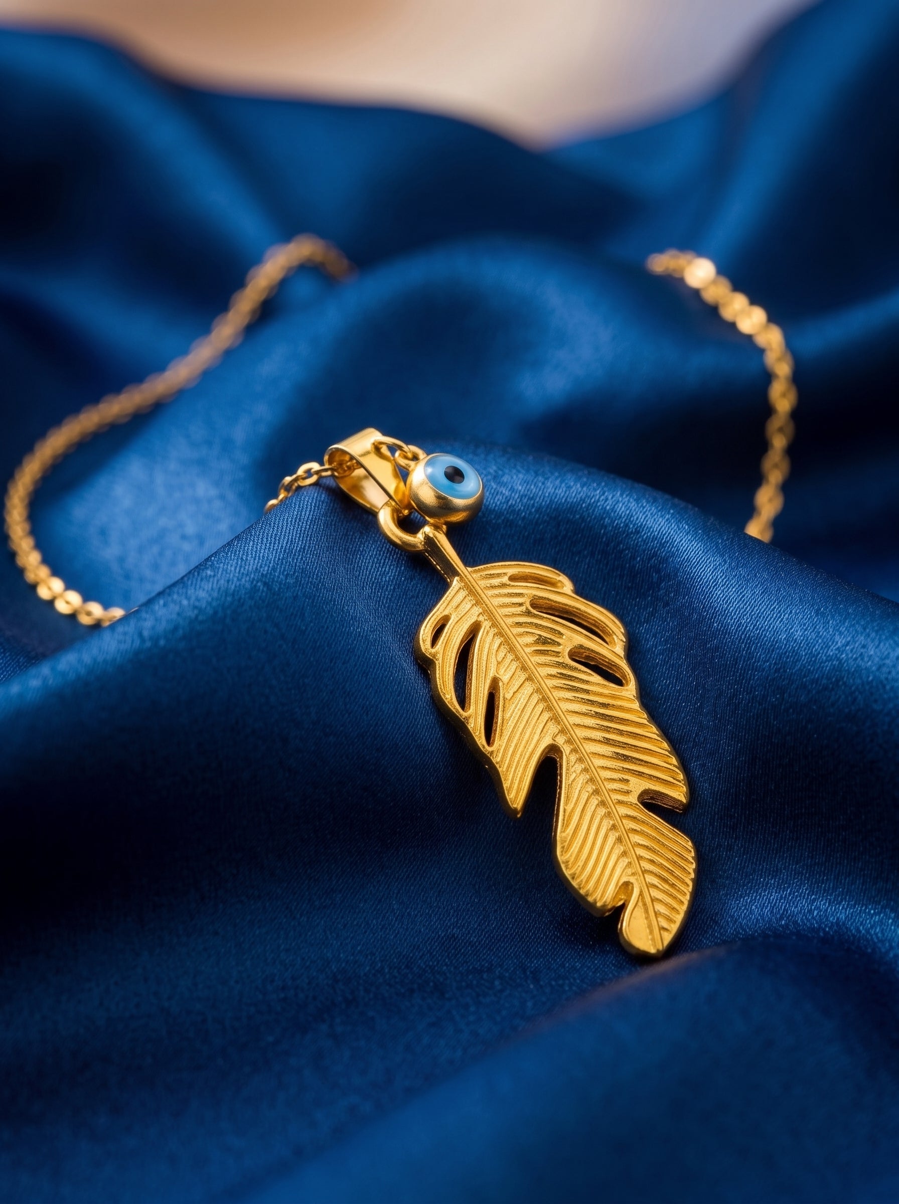 The Golden Feather & Evil Eye Charm Necklace